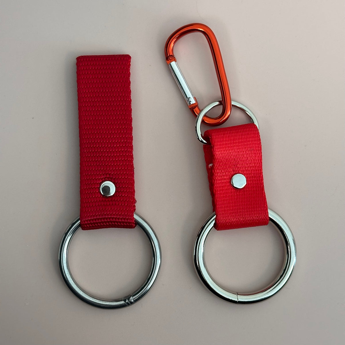 Bandana holder attachment styles: belt loop on the left and carabiner clip-on on the right